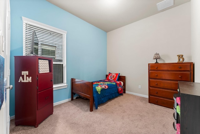 bedroom featuring light carpet, baseboards, and visible vents