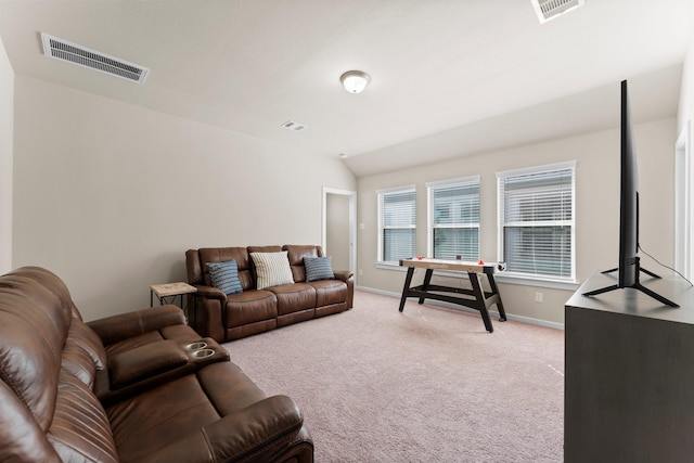 living room with light colored carpet, visible vents, and lofted ceiling