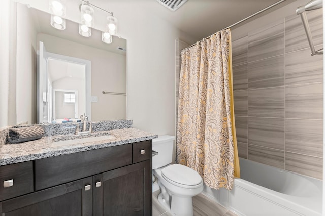 full bathroom featuring toilet, vanity, visible vents, and shower / bathtub combination with curtain