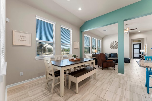 dining room featuring a healthy amount of sunlight, vaulted ceiling, a ceiling fan, and recessed lighting