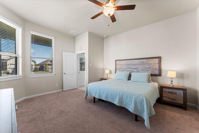 bedroom with carpet floors, visible vents, and baseboards