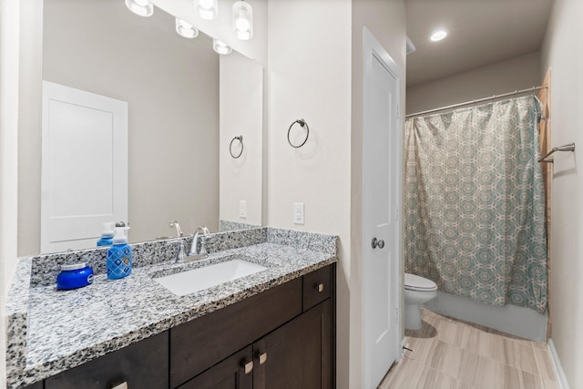 full bathroom featuring shower / tub combo, vanity, and toilet