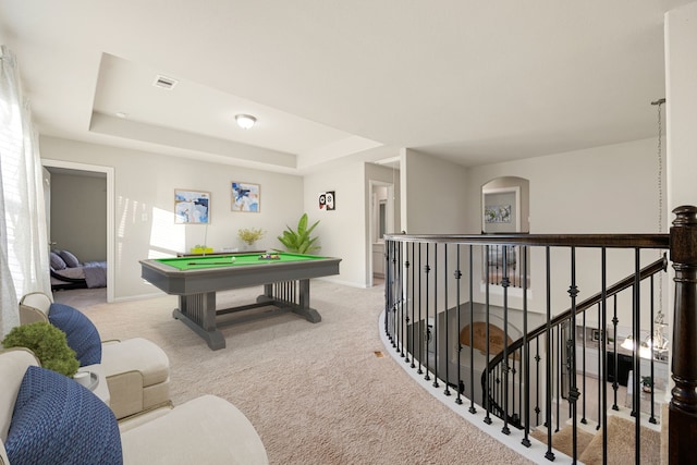 rec room with a tray ceiling, visible vents, light carpet, billiards, and baseboards