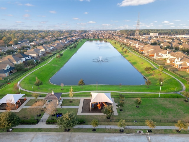 bird's eye view featuring a water view and a residential view