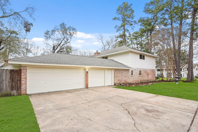 view of home's exterior featuring a garage and a lawn