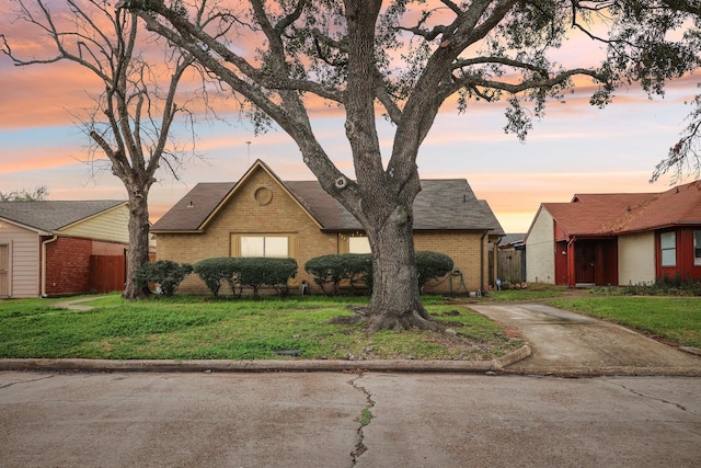 ranch-style house with a yard