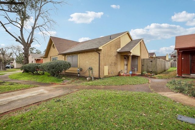 view of property exterior with a yard