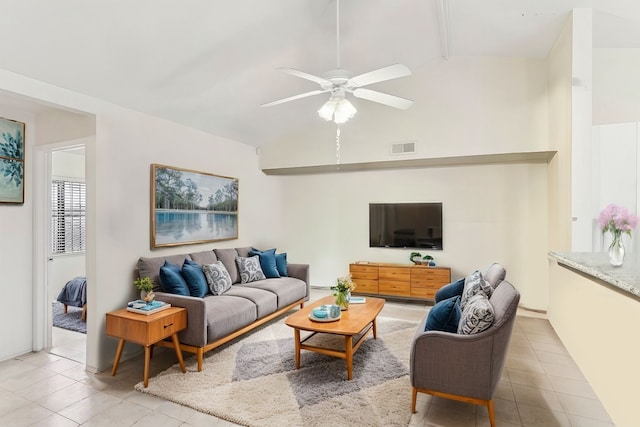 tiled living room featuring lofted ceiling and ceiling fan