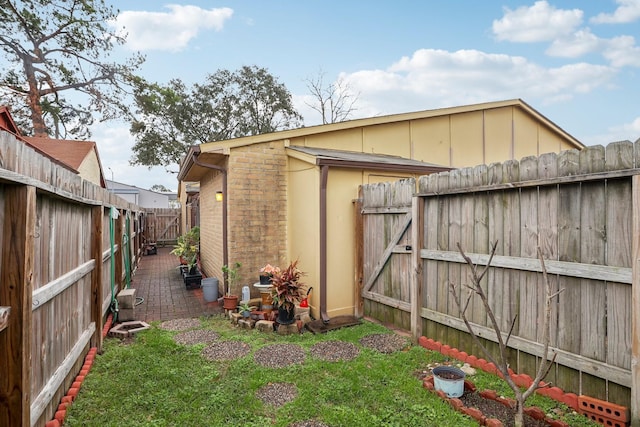 view of property exterior featuring a lawn