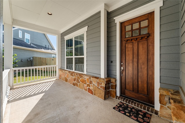 property entrance featuring covered porch