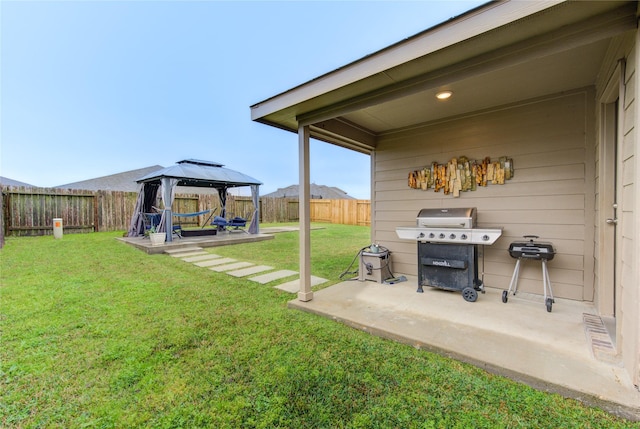 view of yard featuring a mountain view, a patio area, and a gazebo