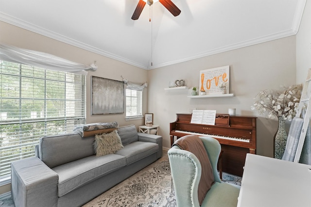 living room with lofted ceiling, ceiling fan, and crown molding