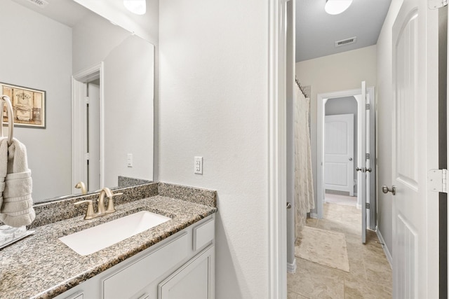 full bath featuring vanity and visible vents