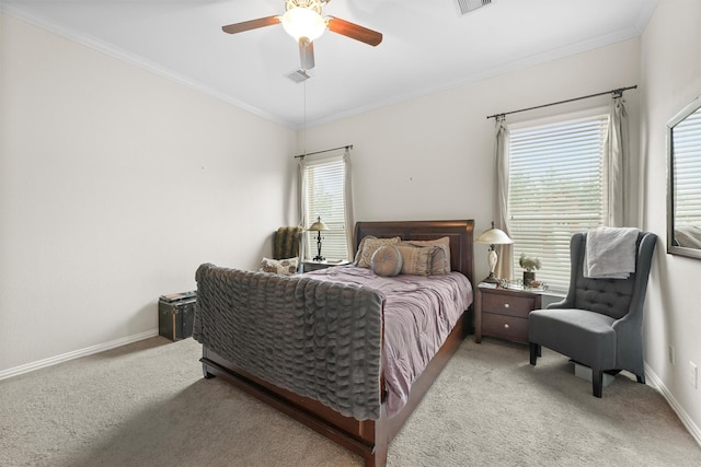 bedroom with baseboards, crown molding, and light colored carpet