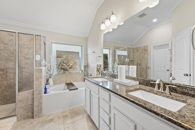 bathroom with crown molding, vaulted ceiling, visible vents, and a sink