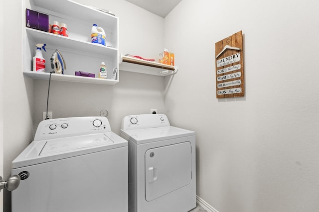 laundry room with washing machine and dryer, laundry area, and baseboards