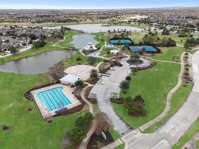 drone / aerial view with a water view and a residential view