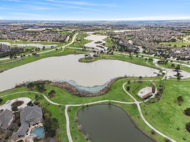 birds eye view of property with a residential view and a water view