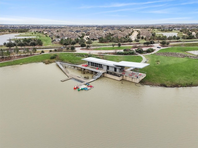 bird's eye view with a water view and a residential view