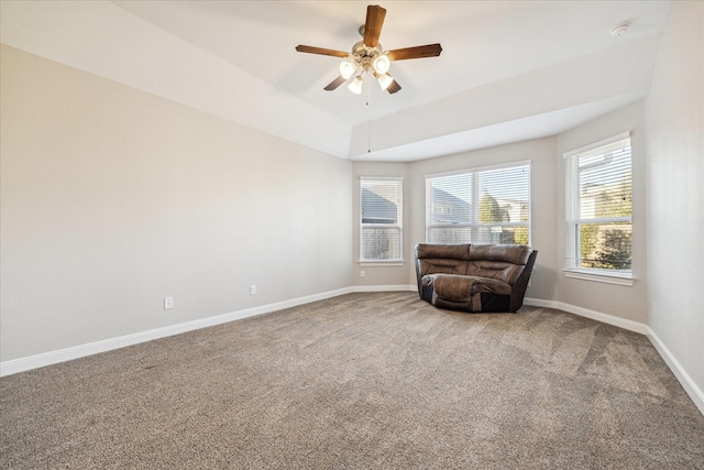 living area with ceiling fan and carpet floors