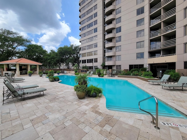 pool featuring a patio area and a gazebo