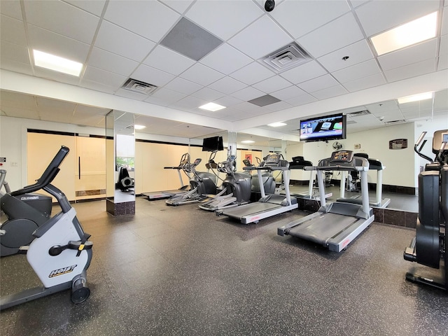 workout area featuring a drop ceiling and visible vents