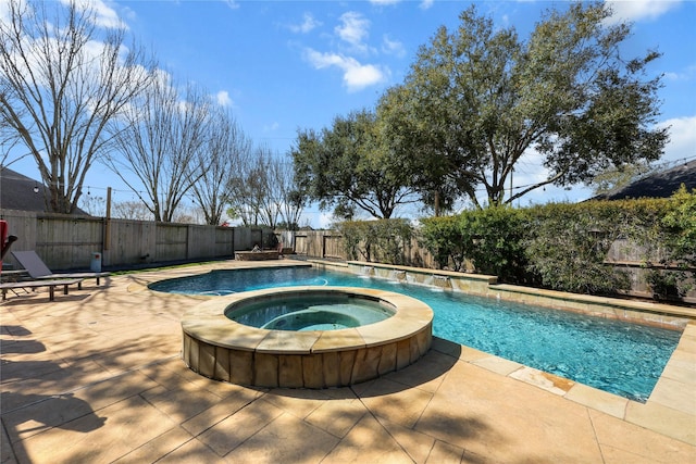 view of pool featuring pool water feature and an in ground hot tub