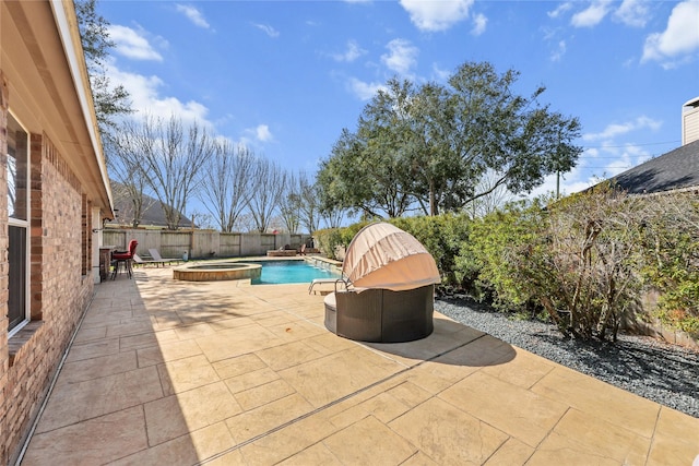 view of patio featuring an in ground hot tub