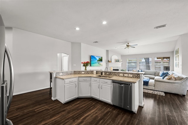 kitchen with sink, ceiling fan, stainless steel appliances, dark hardwood / wood-style flooring, and white cabinets