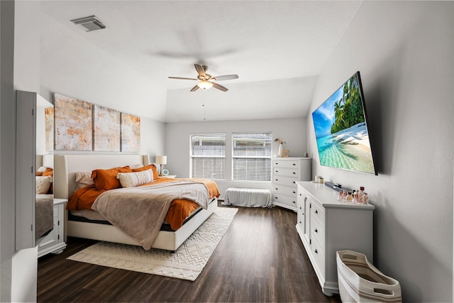 bedroom featuring lofted ceiling, ceiling fan, and dark hardwood / wood-style floors