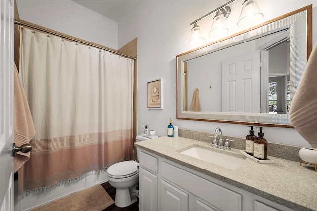 full bathroom featuring toilet, vanity, and shower / tub combo