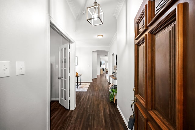 hall featuring dark wood-type flooring and crown molding