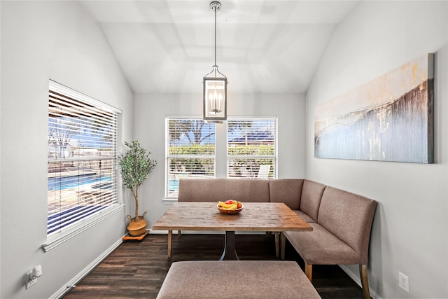 living area with vaulted ceiling, plenty of natural light, and breakfast area