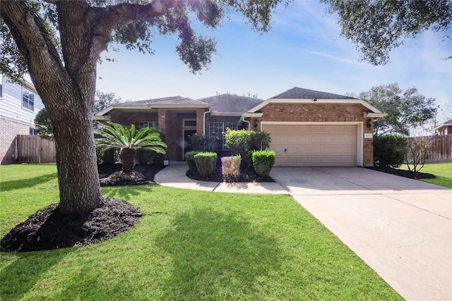 single story home featuring a garage and a front yard