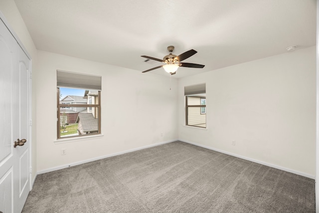 spare room with carpet flooring and ceiling fan