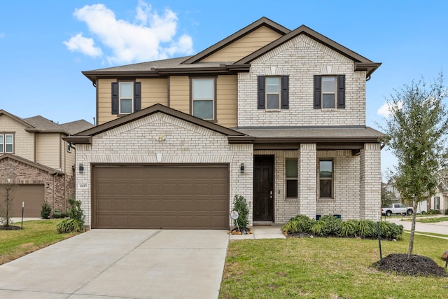 view of front of property featuring a front lawn and a garage