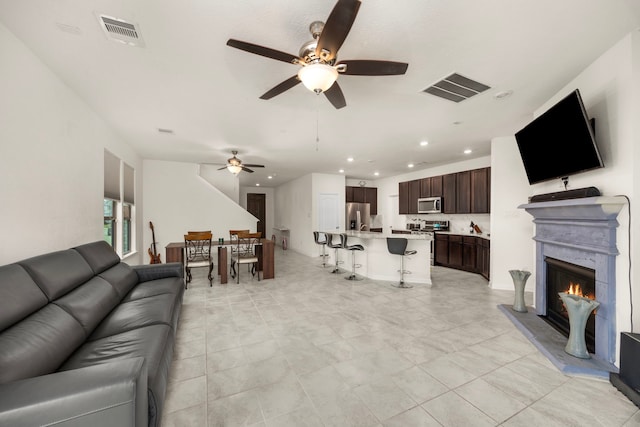 living room with ceiling fan