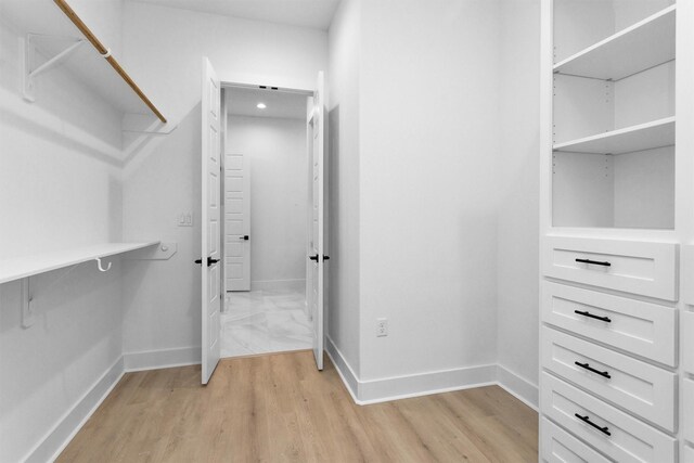 19918 Live Oak Bnd, Magnolia, TX 77355 - spacious closet with light wood finished floors