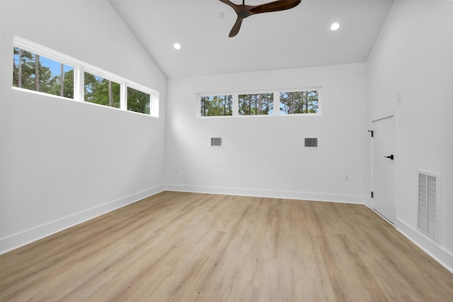 19918 Live Oak Bnd, Magnolia, TX 77355 - empty room with visible vents, light wood finished floors, ceiling fan, recessed lighting, and lofted ceiling