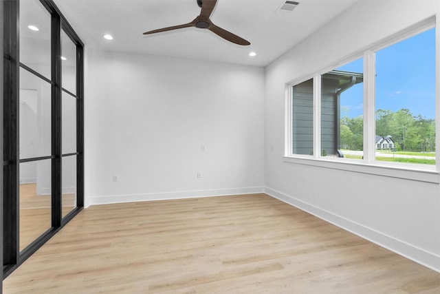 19918 Live Oak Bnd, Magnolia, TX 77355 - spare room featuring a ceiling fan, light wood-type flooring, baseboards, visible vents, and recessed lighting