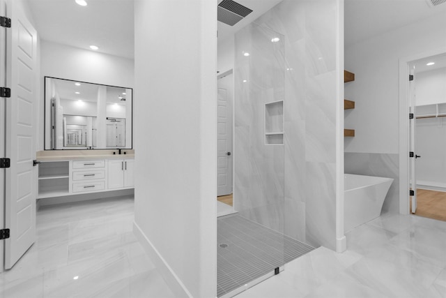 19918 Live Oak Bnd, Magnolia, TX 77355 - full bathroom featuring marble finish floor, a freestanding bath, vanity, and walk in shower
