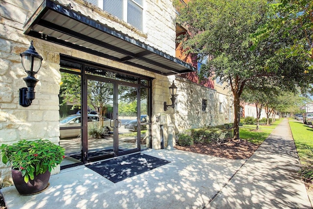 view of exterior entry featuring french doors