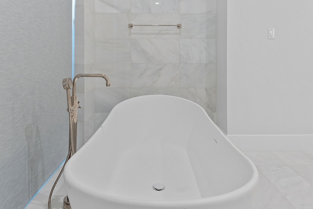 bathroom with a tub to relax in