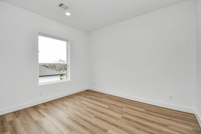 spare room with light hardwood / wood-style floors