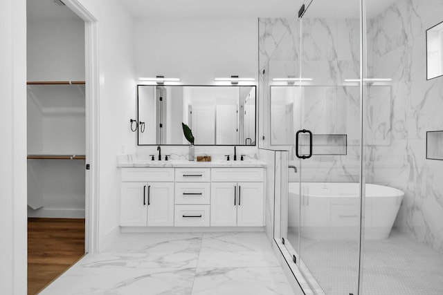 bathroom featuring vanity and plus walk in shower