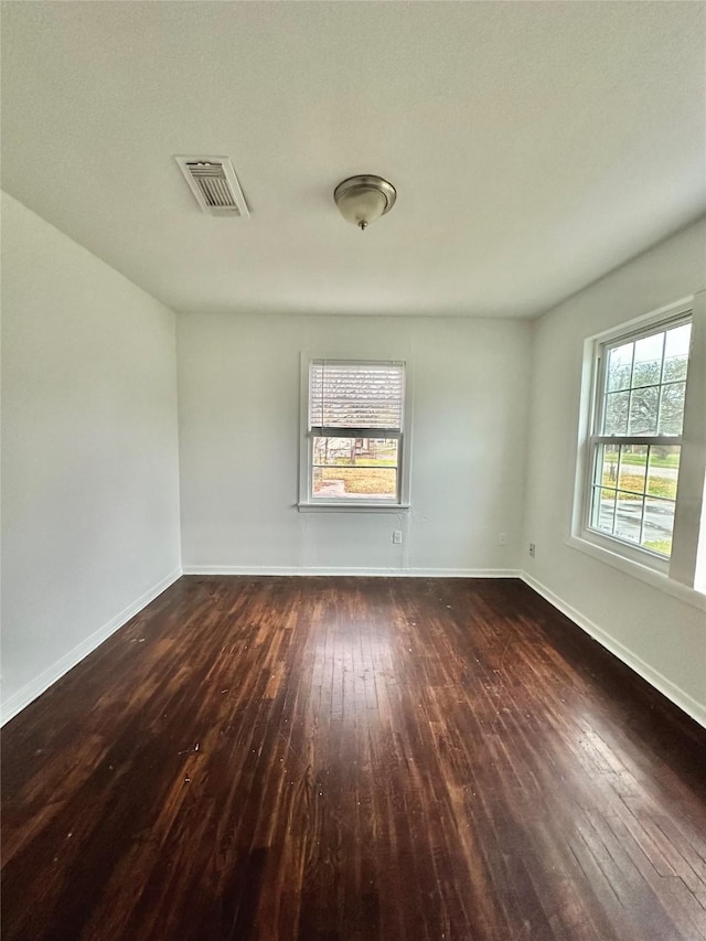 empty room featuring dark hardwood / wood-style floors