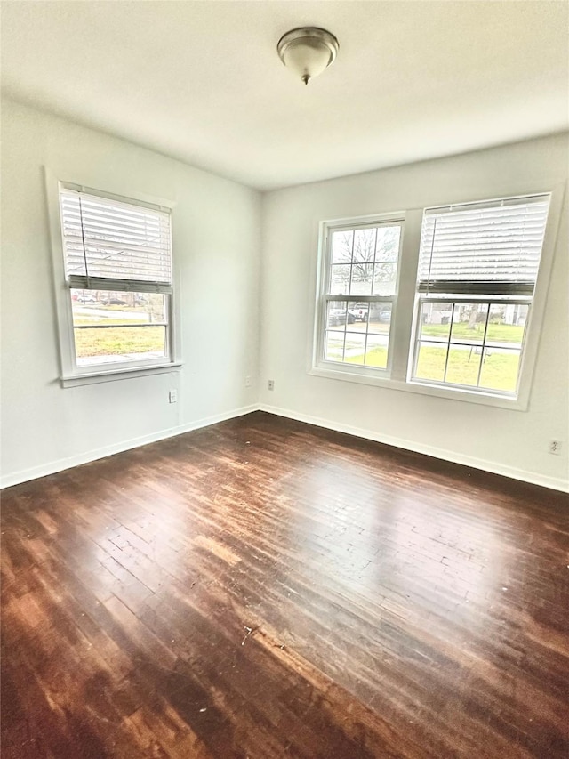 empty room featuring dark wood-type flooring