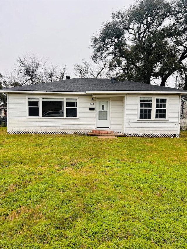 ranch-style home with a front yard