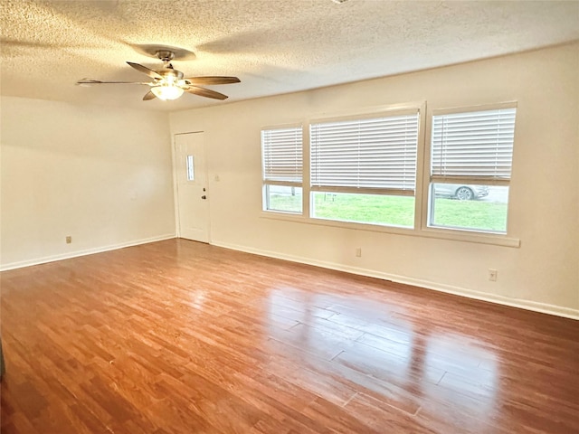 unfurnished living room with hardwood / wood-style floors, ceiling fan, and a textured ceiling