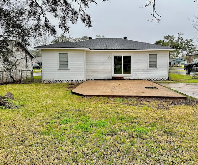 rear view of property with a patio and a yard